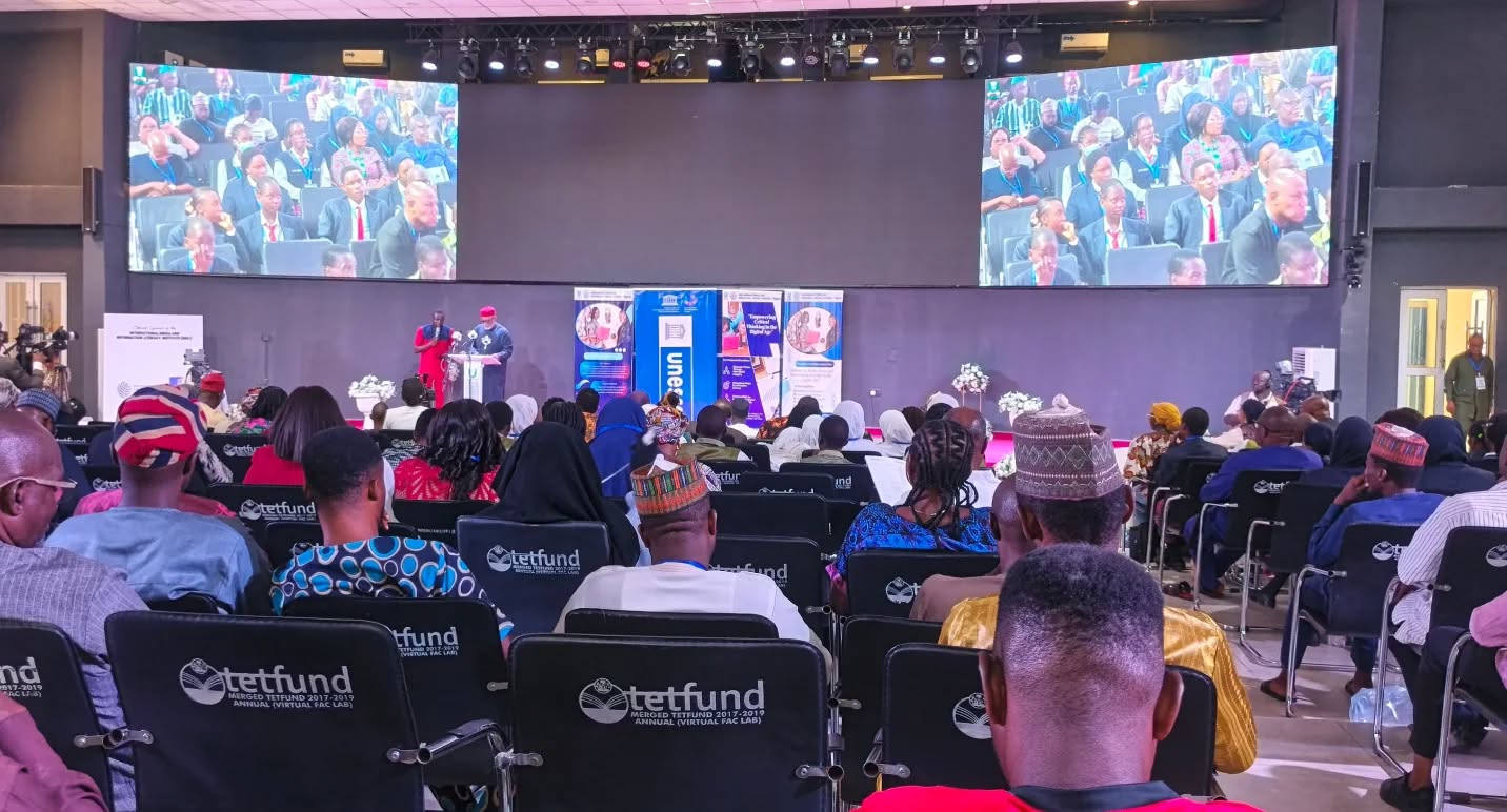 IMILI launch ceremony in an auditorium with UNESCO branding and audience